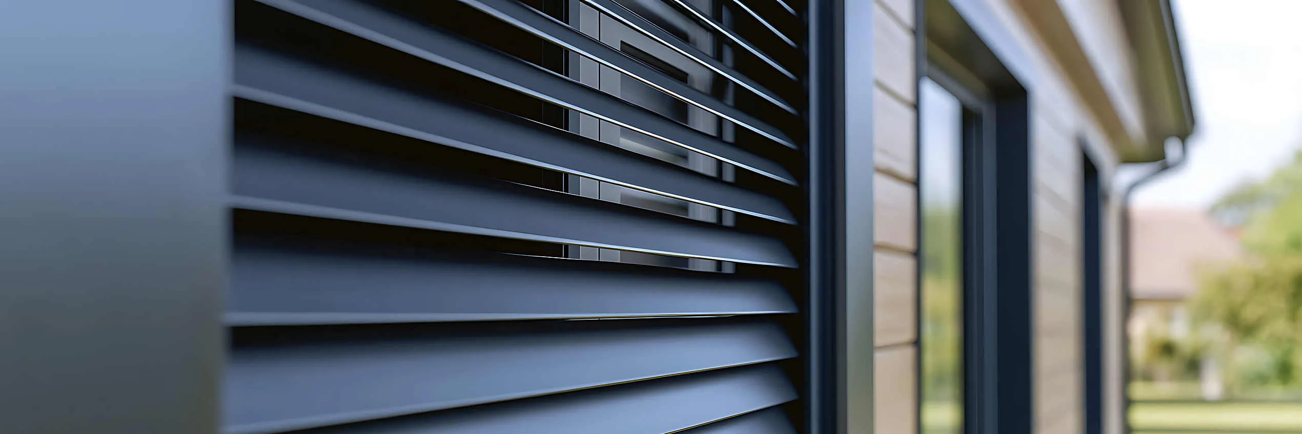 Close-up of an aluminum electric roller shutter on a newly built home.